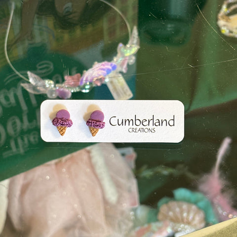 Earring set with 'Cumberland Creations' label on a green background
