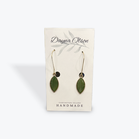 Green leaf-shaped earrings on a 'Dayna Otson' card with 'Vancouver Island Handmade' text.