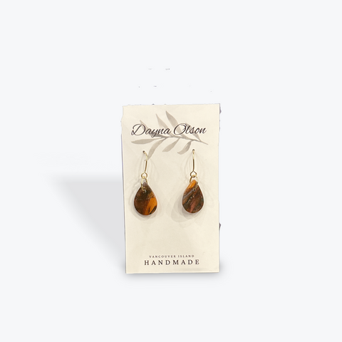 Pair of tiger eye teardrop earrings on a 'Dawna Olson' branded card against a white background