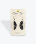 Pair of black and white marbled earrings on a 'Dayna Olson' branded card.