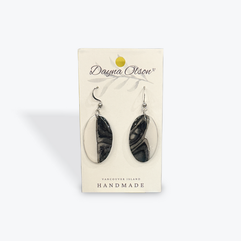 Pair of black and white marbled earrings on a 'Dayna Olson' branded card.