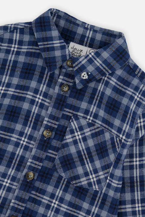 Close-up of the blue and white plaid, collar, buttons and chest pocket on the Deux par Deux shirt.