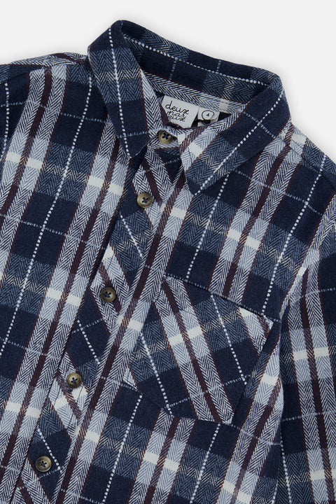 Close-up of the plaid flannel fabric, collar and chest pocket on the Deux par Deux blue and white shirt.