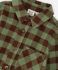 Close-up of the green and brown plaid, collar and buttons on the Deux par Deux brushed flannel shirt.