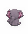 A small elephant-shaped accessory, likely a brooch or charm, in a textured lavender-purple color with glittery pink inner ears and tiny gold accents on its trunk and feet, shown on a plain white background.
