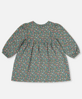 A toddler girl's long-sleeve dress with a green base and a dense multicolor floral print, shown from the back against a light gray background. A small label in the top right corner reads 'Coton biologique'.