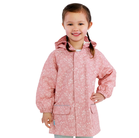 Child wearing a pink floral raincoat on a white background