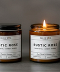 Isle of Rose Rustic Rose candle with packaging on a gray background