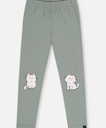 A pair of sage green children's leggings with two white cartoon cat graphics on the lower legs, displayed flat against a light gray background.