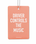 A pink double-sided air freshener with the text 'DRIVER CONTROLS THE MUSIC' printed in black. It comes with a white nylon hanging cord.