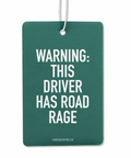 A green double-sided air freshener with the text 'WARNING: THIS DRIVER HAS ROAD RAGE' printed on the front side, attached to a nylon hanging cord.