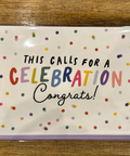 A greeting card with the text 'This calls for a CELEBRATION Congrats!' surrounded by colorful dots pattern.