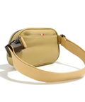 Beige crossbody bag with a strap on a white background