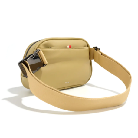 Beige crossbody bag with a strap on a white background