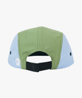 Color-blocked cap with green and light blue sections on a white background