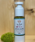 Skincare bottle labeled 'Sole Glow' on a wooden surface with a small green plant.