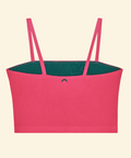 Pink top with green lining on a beige background