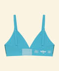 Blue bikini top with 'huka' branding on a beige background