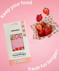 Naturebee reusable beeswax food wraps packaging with strawberries on a pink background
