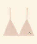Pink bralette with thin straps on a beige background