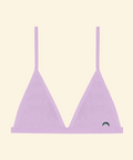 Lavender triangle bikini top on a beige background