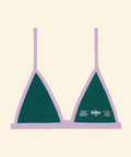 Green bikini top with purple straps on a beige background