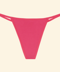 Pink thong bikini bottom on a beige background