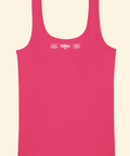 Pink tank top with 'höra' branding on a beige background