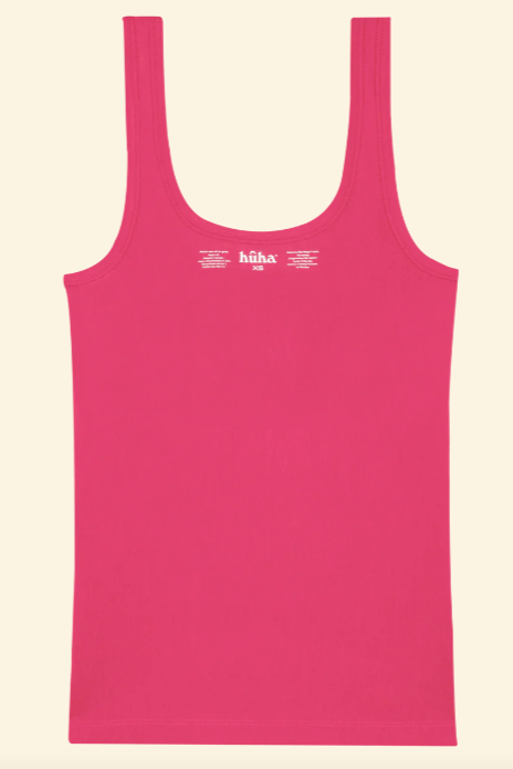 Pink tank top with 'höra' branding on a beige background