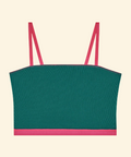 Green crop top with pink straps on a beige background