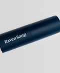 Navy blue cylindrical device with 'Raven Song' branding on a light gray background