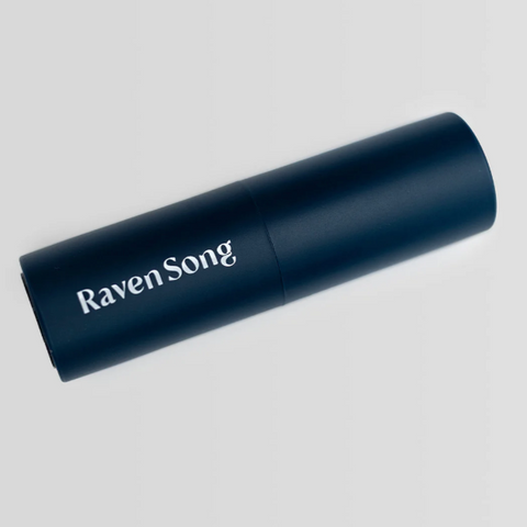 Navy blue cylindrical device with 'Raven Song' branding on a light gray background
