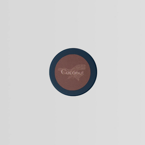 Round blush compact labeled 'Coconut' on a light gray background