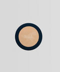 Round compact powder with peach color on a light gray background