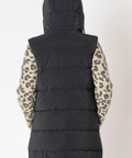 Black puffer vest worn over a leopard print jacket on a plain background