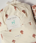 Two crib sheets with tags on a website page, featuring 'bambi & birdie' brand.
