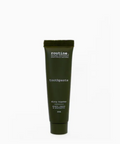 Dark green tube of 'routine' toothpaste on a white background