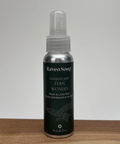 Raven Song room and linen mist bottle on a wooden surface with a white background
