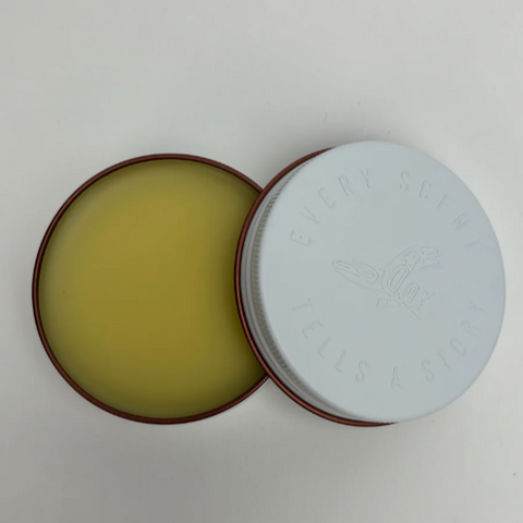 Open round container with a white lid on a gray background