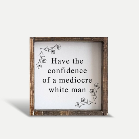 Wooden framed sign with text on a white background