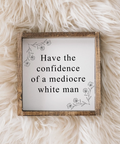 Wooden sign with text on a fluffy white surface