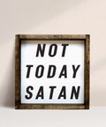 Framed sign with 'Not Today Satan' text on a plain background