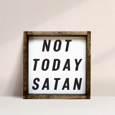 Framed sign with 'Not Today Satan' text on a plain background