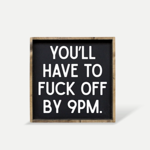 Black sign with white text on a white background