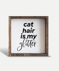 Wooden framed sign with 'cat hair is my glitter' text on a white background