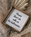 Small wooden sign with text on a textured surface