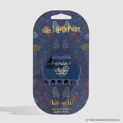 Blue claw clip with decorative element on a 'Harry Potter' branded packaging
