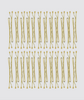 Multiple gold hair pins arranged in rows on a light gray background