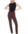 Woman wearing brown pants and a black top on a white background