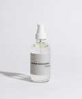 Clear bottle with a white cap on a light gray background